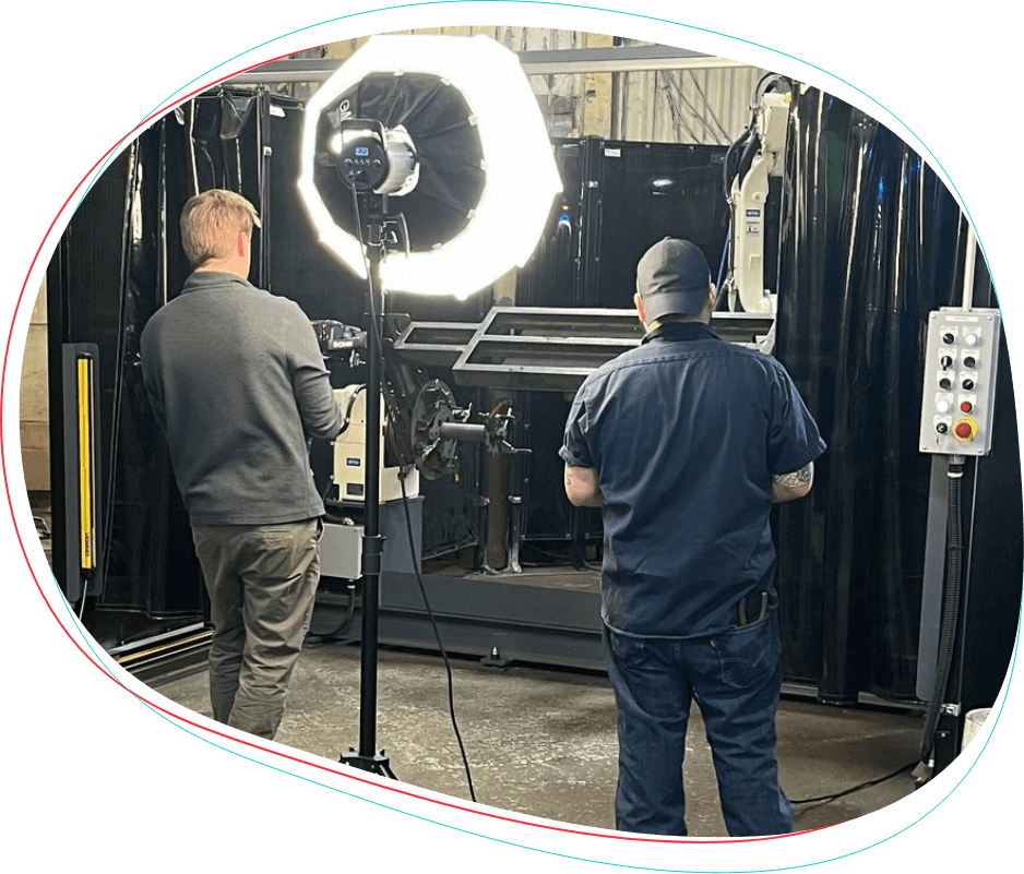 Marketing team member working with manufacturing doing video work