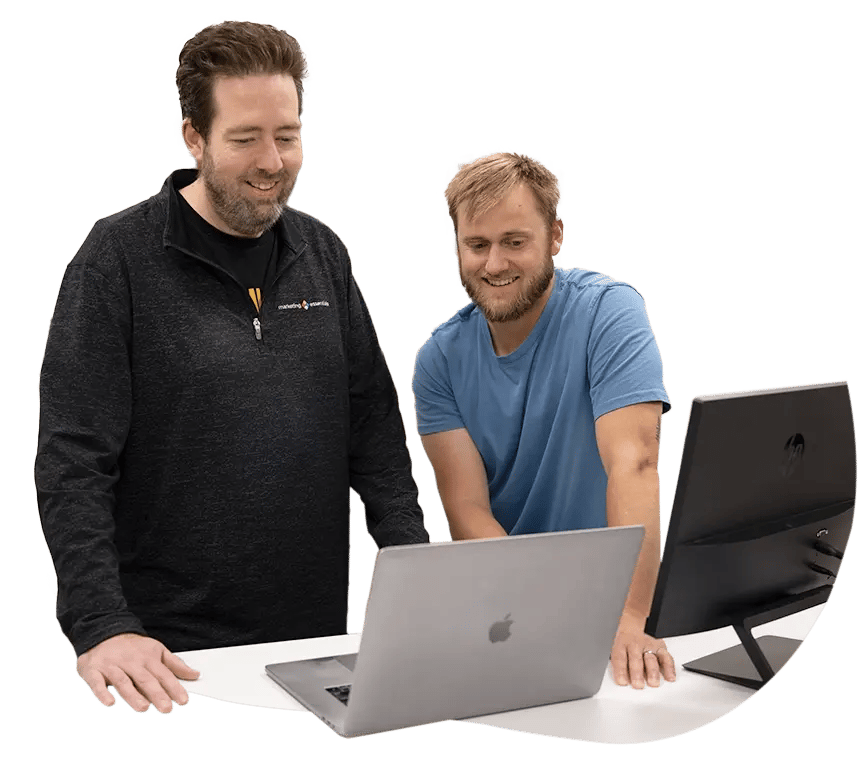 Two men working at a computer