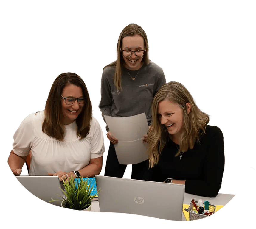 Project managers working at a computer