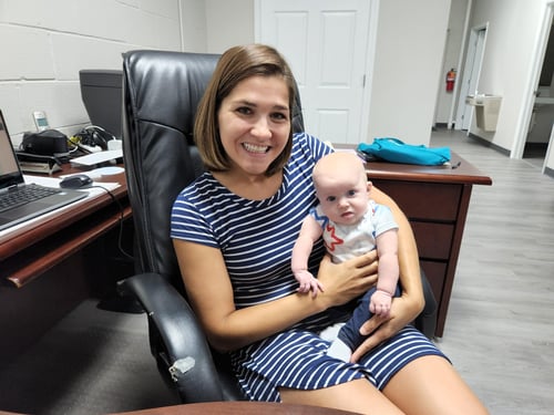 Alyssa Lauck, director of the Family Life Center of Auglaize County with Laura’s daughter Via