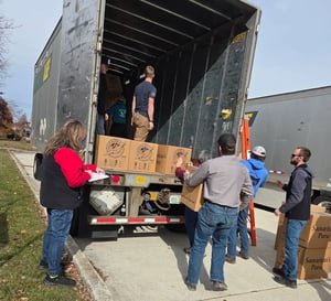 The OCC team loading and verifying shoeboxes 