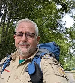 Mark walking with backpack