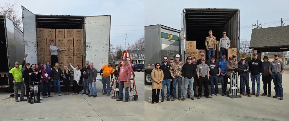 Volunteers loading shoeboxes in trailers