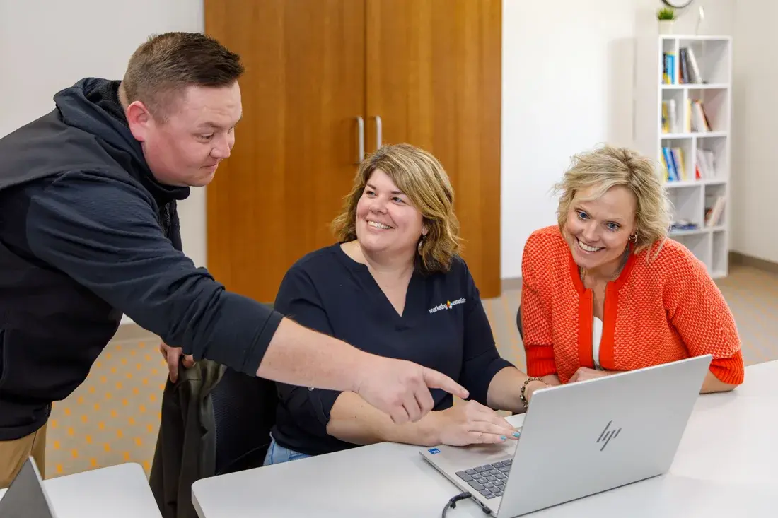 Marketing Essentials team members shaking hands