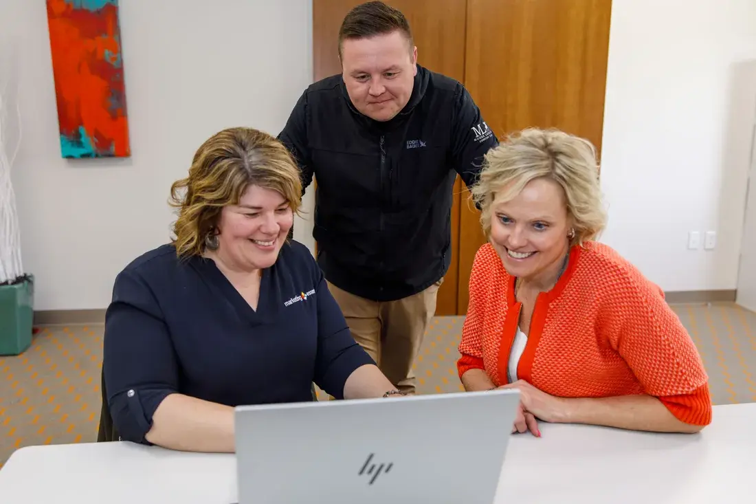 Marketing Essentials team members shaking hands