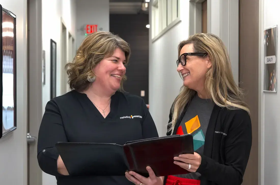 Marketing Essentials team members shaking hands