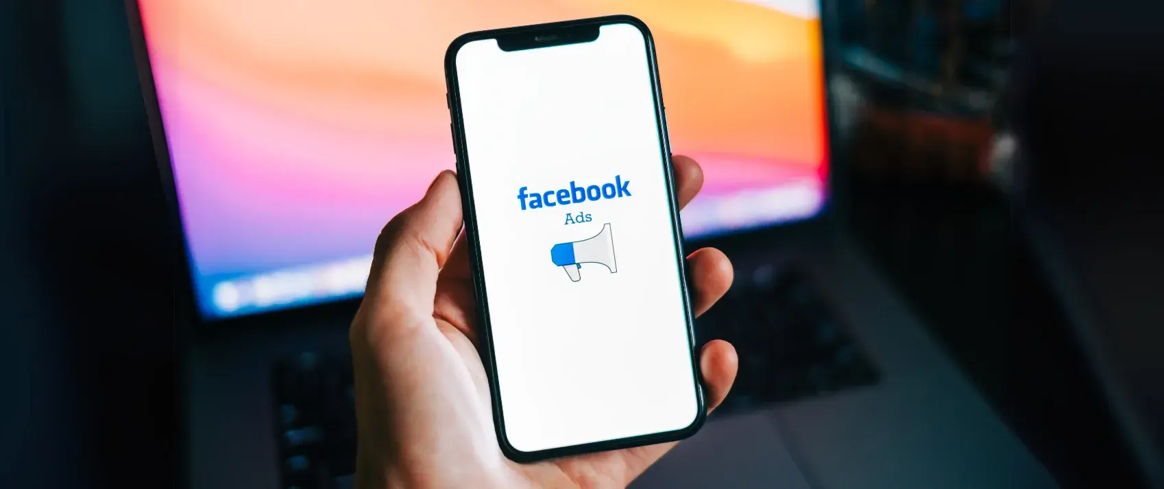 iPhone with Facebook Ads Logo