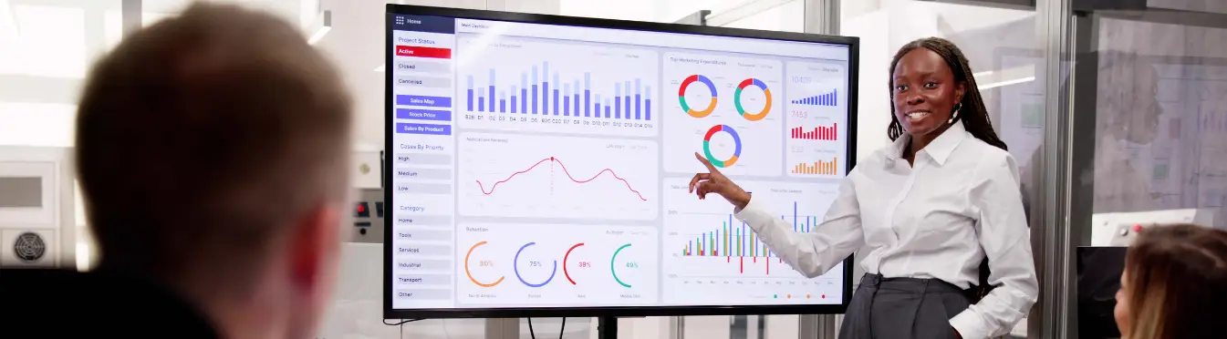 Marketing Executive talking through Marketing Analytics with a Manufacturing Executive