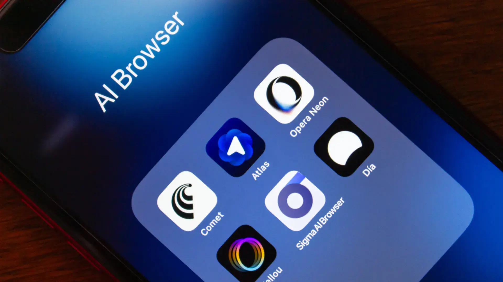 Close-up of a smartphone displaying AI browser icons